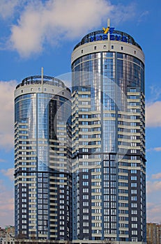 Residential complex Sunny riviera. Text on roof-UKRBUD. Two modern luxury skyscrapers against sky